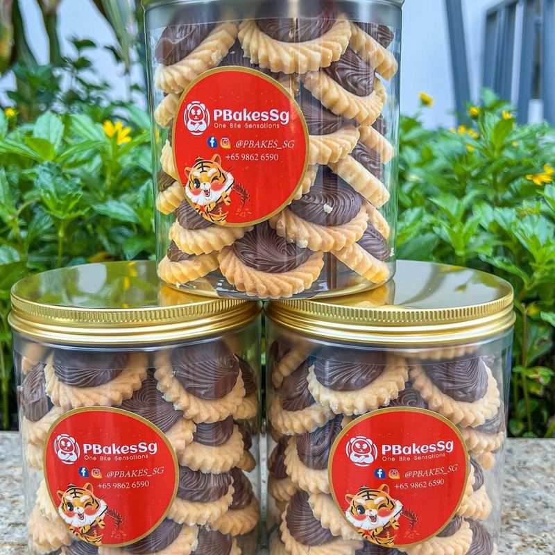 A bottle of PbakesSg Nutella tart cookies, baked in our home kitchen in Singapore